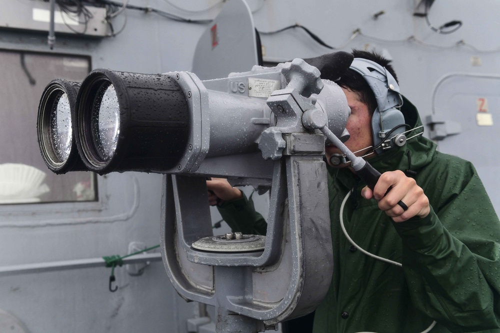 USS San Diego (LPD 22) Sailor Stands Watch in Rain