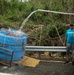 Collecting Water on the Side of the Road