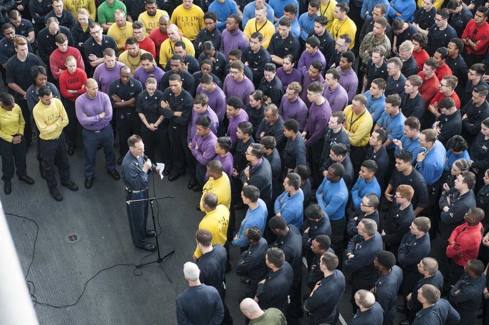 Captain Joe Olson addresses the crew of the USS America (LHA 6).