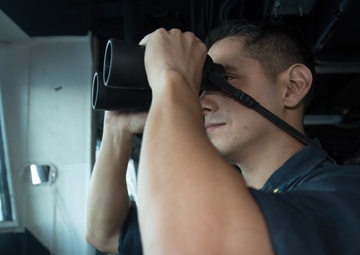 USS Pearl Harbor Sailors stand watch