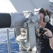 USS America (LHA 6) Sailor stands watch on forward lookout