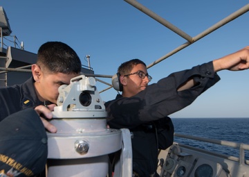 USS Pearl Harbor Sailors stand watch