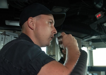 USS Pearl Harbor Sailors stand watch