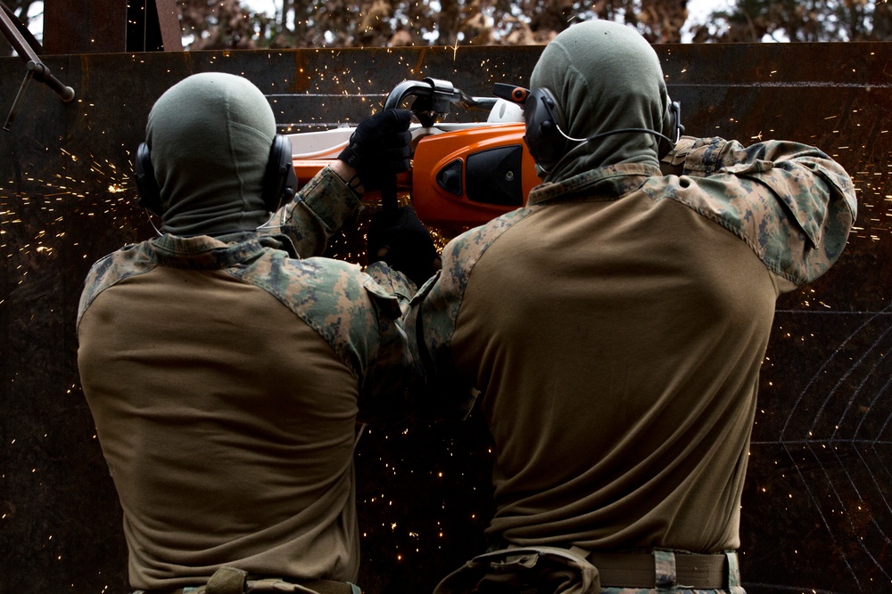 Methods of Entry School Marines Cut a Steel Plate