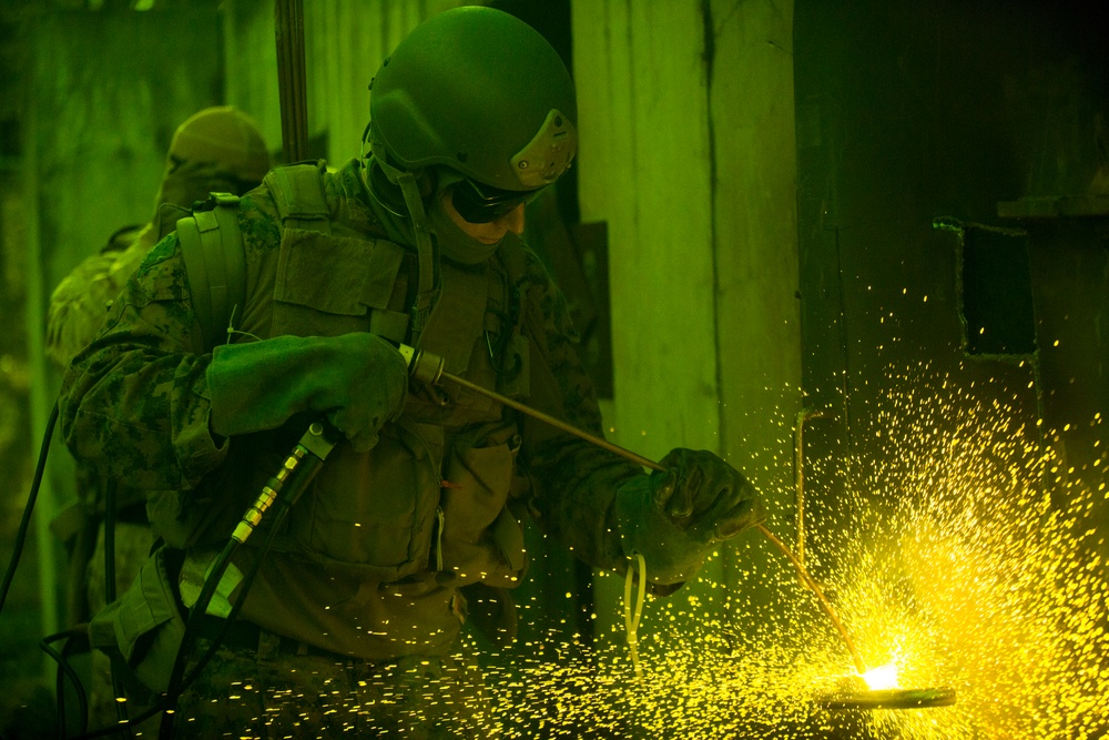 Methods of Entry School Marines Breach a Ship Entryway