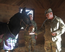 Maj. Gen Flem "Donnie" Walker, Jr. Feeds Corporal Blackjack