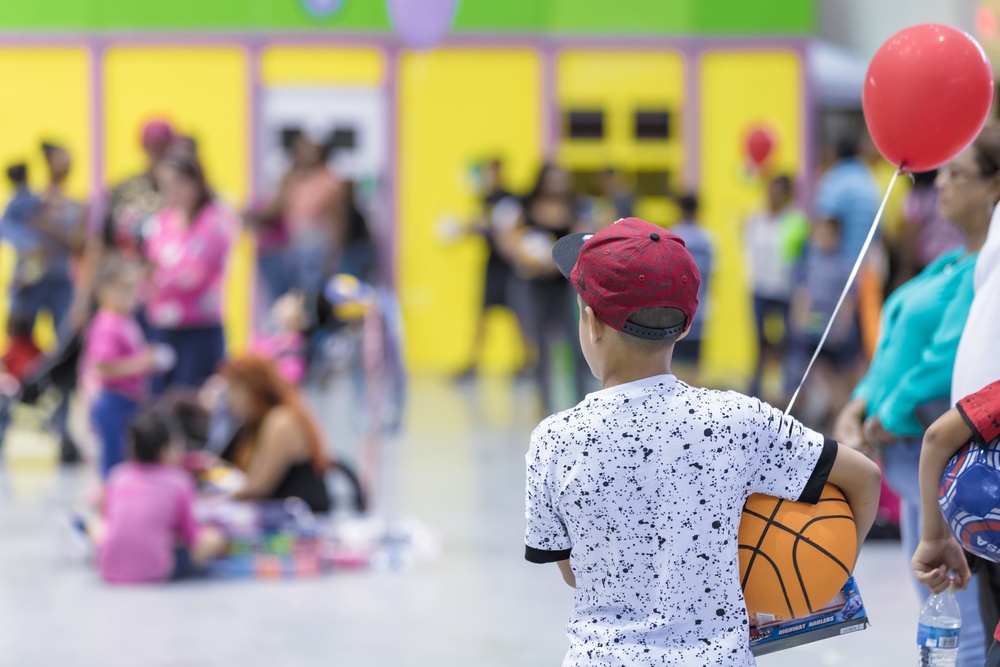 Boy Holding His Gifts Received During The Grand Three Kings Celebration