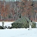 Cold-Weather Operations Course Class 18-02 students build Arctic tents during training at Fort McCoy