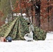 Cold-Weather Operations Course Class 18-02 students build Arctic tents during training at Fort McCoy