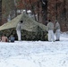 Cold-Weather Operations Course Class 18-02 students build Arctic tents during training at Fort McCoy