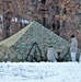 Cold-Weather Operations Course Class 18-02 students build Arctic tents during training at Fort McCoy