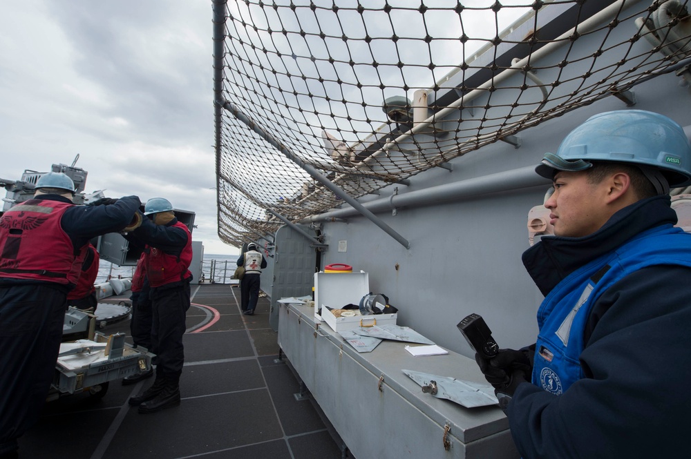 USS Bonhomme Richard (LHD 6) Fire Controlman load NATO Sea Sparrow missiles