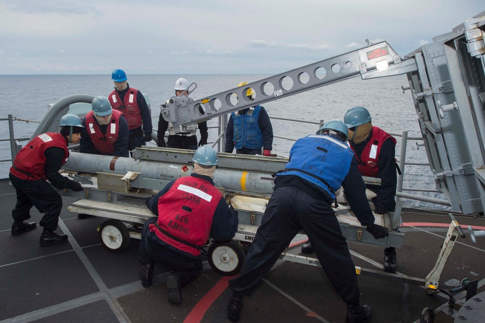 USS Bonhomme Richard (LHD 6) Fire Controlman load NATO Sea Sparrow missiles