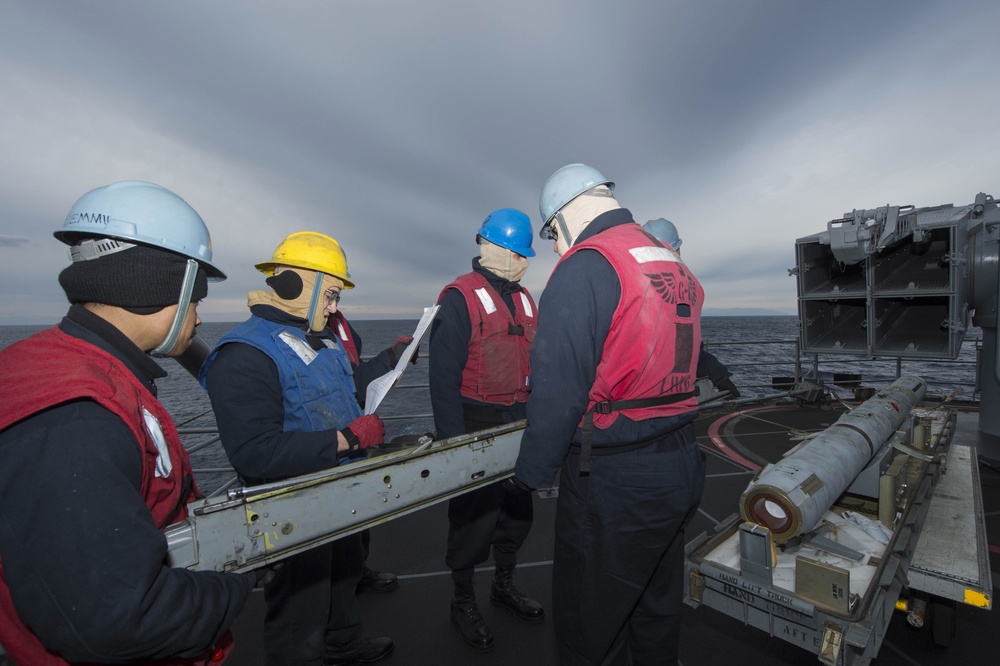 USS Bonhomme Richard (LHD 6) Fire Controlman load NATO Sea Sparrow missiles