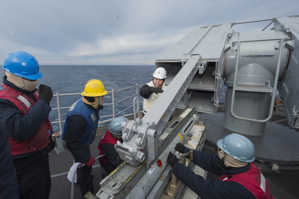 USS Bonhomme Richard (LHD 6) Fire Controlman load NATO Sea Sparrow missiles