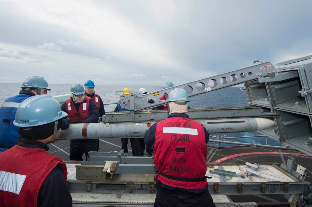 USS Bonhomme Richard (LHD 6) Fire Controlman load NATO Sea Sparrow missiles