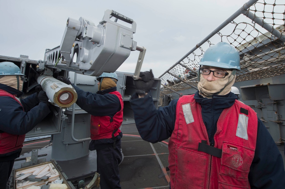 USS Bonhomme Richard (LHD 6) Fire Controlman load NATO Sea Sparrow missiles