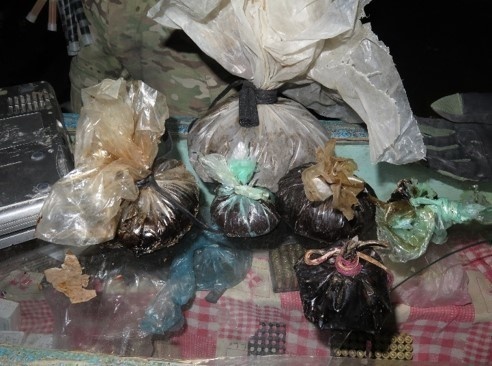 Taliban guns, drugs, and explosives seized by Afghan Special Security Forces in Helmand