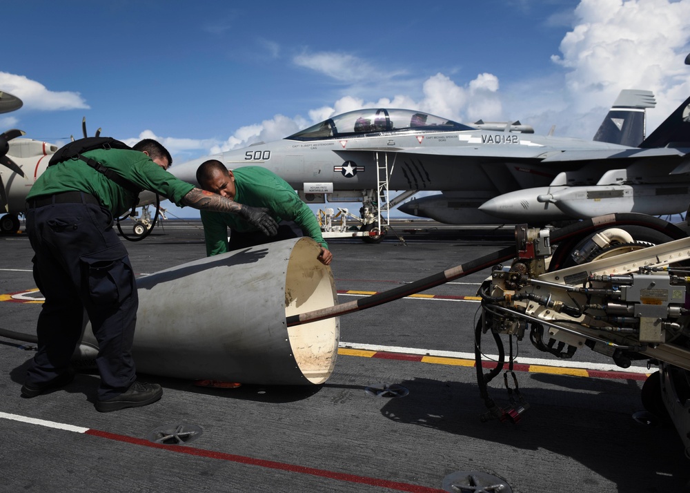 Sailors Attach Fuel Pod Cover