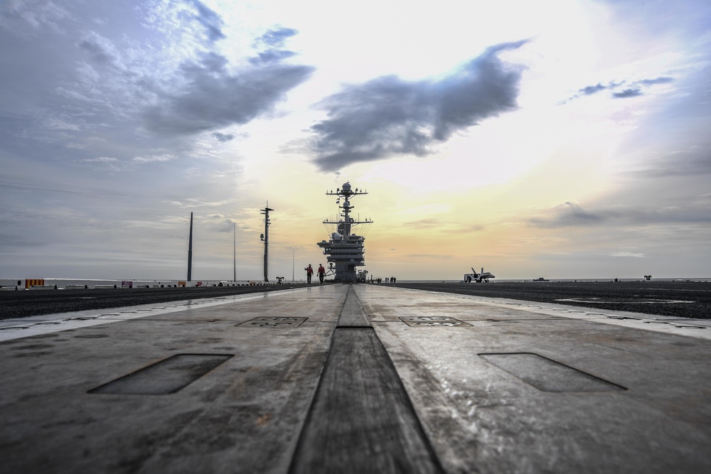 Stennis Sailors walk the deck