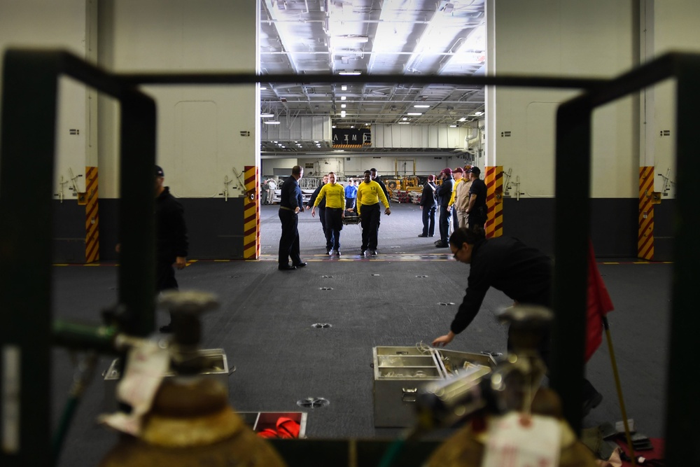 Stennis Sailors perform mass casualty drill.