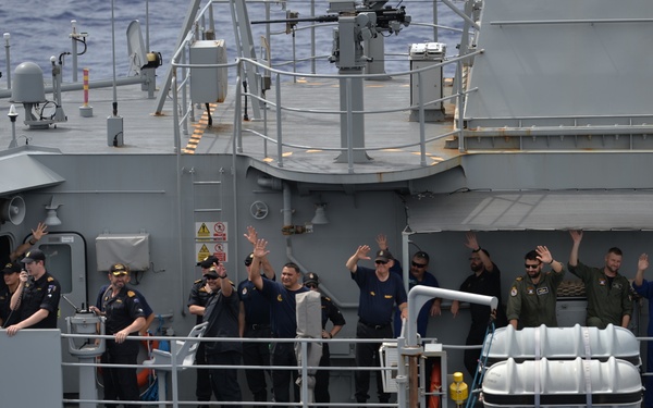 HMNZS Te Kaha (F77) Sailors Wave at USS Nimitz (CVN 68)