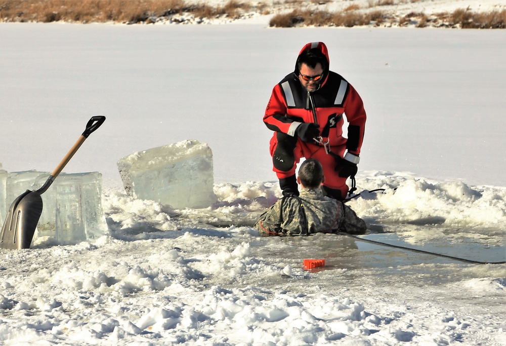 Service members battle icy conditions in cold-water immersion training at Fort McCoy