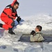 Service members battle icy conditions in cold-water immersion training at Fort McCoy
