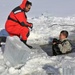 Service members battle icy conditions in cold-water immersion training at Fort McCoy