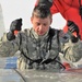 Service members battle icy conditions in cold-water immersion training at Fort McCoy