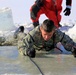 Service members battle icy conditions in cold-water immersion training at Fort McCoy