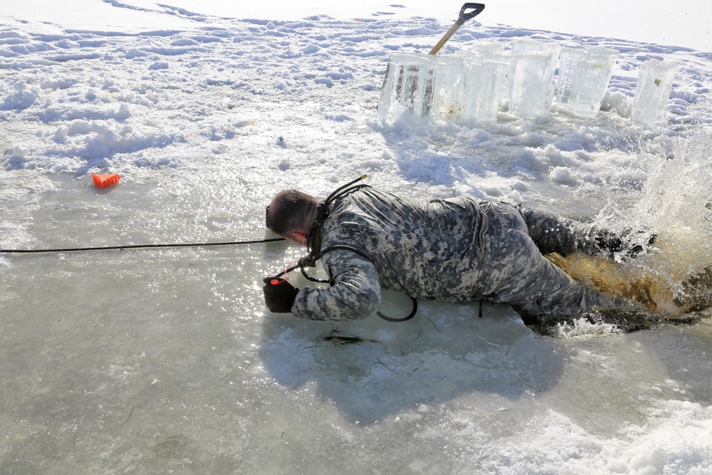 Service members battle icy conditions in cold-water immersion training at Fort McCoy