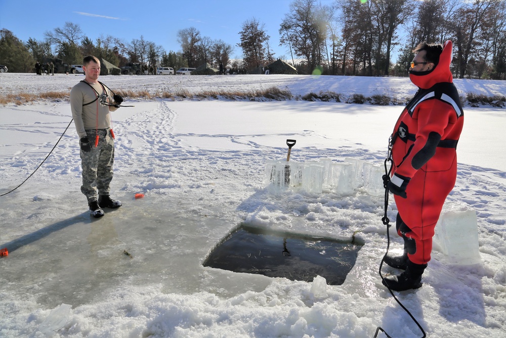 Service members battle icy conditions in cold-water immersion training at Fort McCoy