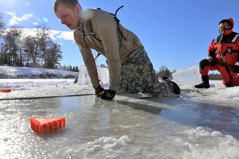 Service members battle icy conditions in cold-water immersion training at Fort McCoy