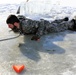 Service members battle icy conditions in cold-water immersion training at Fort McCoy