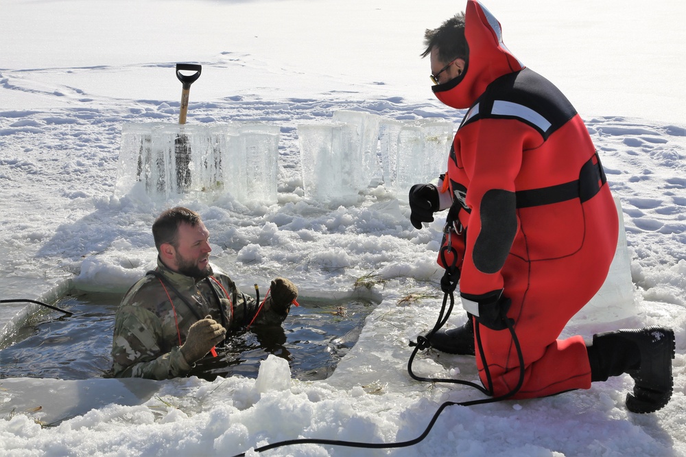 Service members battle icy conditions in cold-water immersion training at Fort McCoy