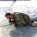 Service members battle icy conditions in cold-water immersion training at Fort McCoy