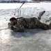 Service members battle icy conditions in cold-water immersion training at Fort McCoy