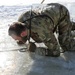 Service members battle icy conditions in cold-water immersion training at Fort McCoy
