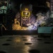Sailor welds a bracket