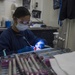 Sailor performs teeth cleaning