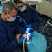 Sailors perform oral surgery