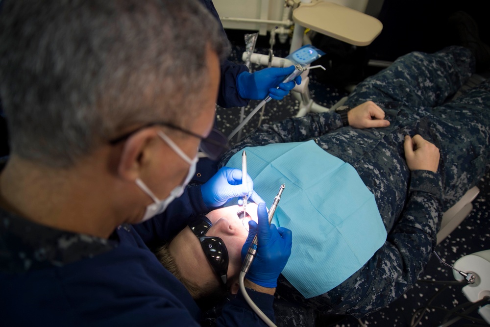 Sailor performs oral surgery