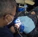 Sailor performs oral surgery