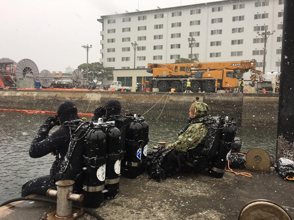 UCT 2 Removes Piles from Sasebo Harbor