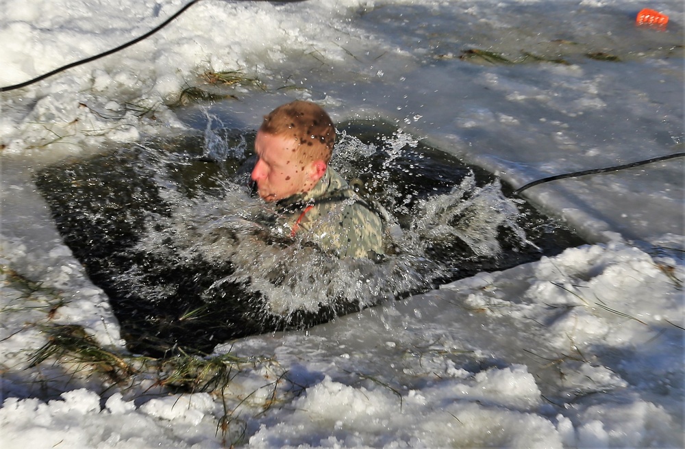 Cold-Weather Operations Course students battle icy conditions in cold-water immersion training at Fort McCoy