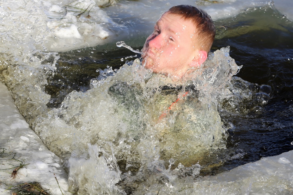 Cold-Weather Operations Course students battle icy conditions in cold-water immersion training at Fort McCoy