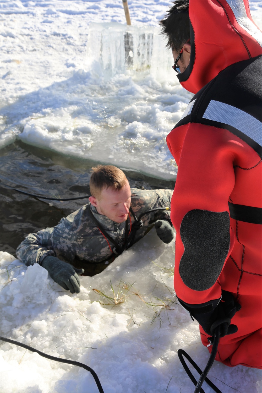 Cold-Weather Operations Course students battle icy conditions in cold-water immersion training at Fort McCoy