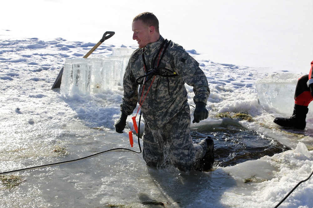 Cold-Weather Operations Course students battle icy conditions in cold-water immersion training at Fort McCoy