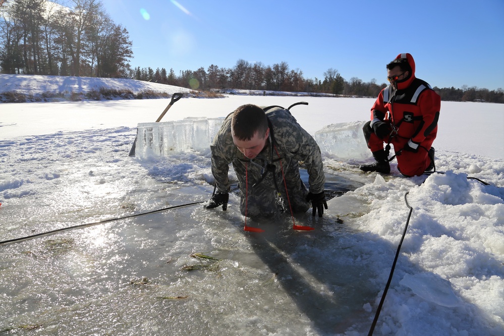 Cold-Weather Operations Course students battle icy conditions in cold-water immersion training at Fort McCoy